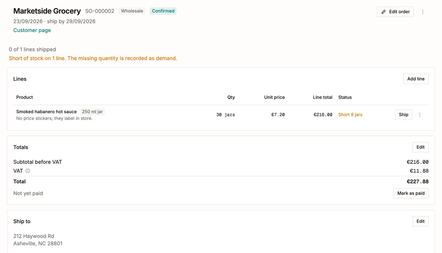 A confirmed sales order in BatchDash: the customer and their trade terms, the ship-by date, a line short of stock with the shortfall recorded as demand, the totals, the unpaid state and the ship-to address.